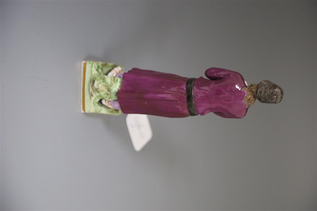 A Russian Gardner porcelain figure of a man holding a staff, mid 19th century, H.21.4cm, loss to left hand and replacement staff
